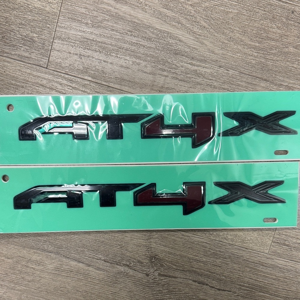 AT4X Black and Red Vehicle Emblem / Nameplate